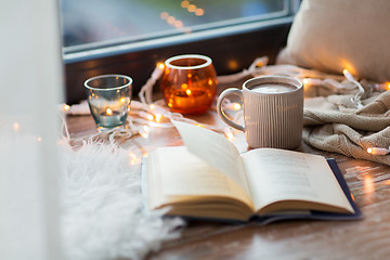 Image showing book and coffee or hot cchocolate on window sill