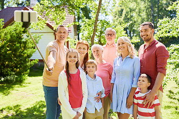 Image showing happy family taking selfie in summer garden