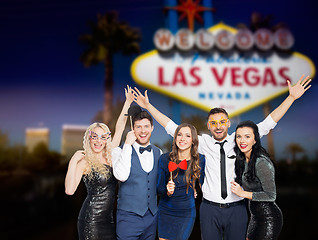 Image showing happy friends with party props posing at las vegas