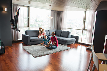 Image showing Happy family playing a video game