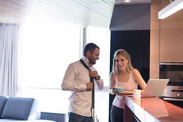 Image showing A young couple is preparing for a job and using a laptop