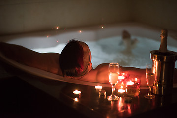 Image showing man relaxing in the jacuzzi