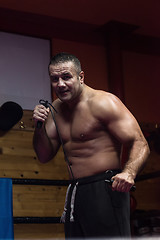 Image showing professional kickboxer in the training ring