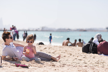 Image showing Mom and daughter on the beach