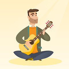 Image showing Man playing the acoustic guitar.