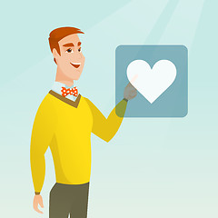 Image showing Young man pressing heart shaped button.