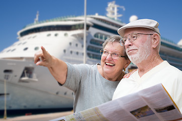 Image showing Happy Senior Adult Couple Tourists with Brochure Next To Passeng