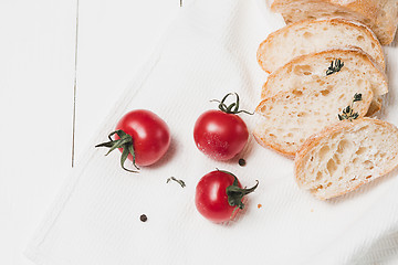 Image showing The fresh bread on a white table background