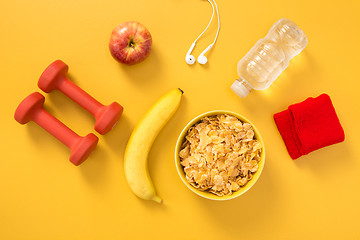 Image showing Healthy lifestyle flat lay on yellow background