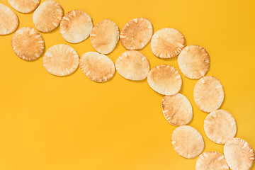 Image showing Pita bread on bright yellow background