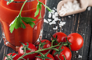 Image showing Closeup of tomato juice and cherry tomatoes