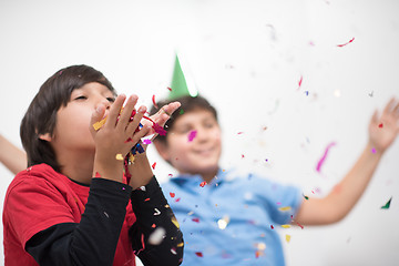 Image showing kids  blowing confetti