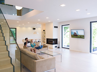 Image showing young happy couple relaxes in the living room