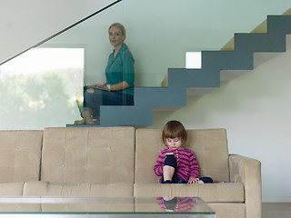 Image showing little girl playing games on smartphone