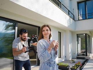 Image showing woman in a bathrobe enjoying morning coffee