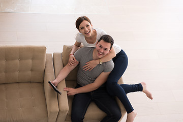 Image showing couple relaxing at  home with tablet computers