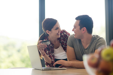 Image showing happy young couple buying online