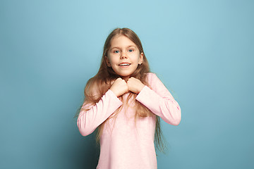 Image showing Win - emotional blonde teen girl have a happiness look and toothy smiling. Studio shot