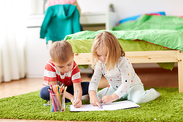 Image showing happy kids drawing at home