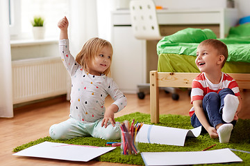 Image showing happy kids drawing at home