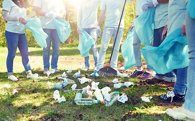 Image showing volunteers with garbage bags cleaning park area