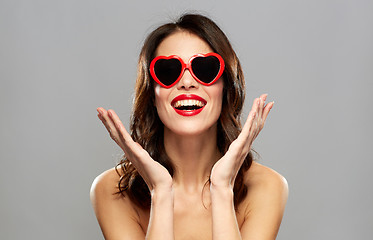 Image showing woman with red lipstick and heart shaped shades