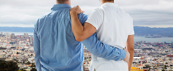 Image showing close up of gay couple hugging over san francisco