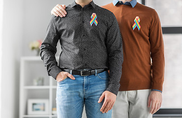 Image showing close up of couple with gay pride rainbow ribbons