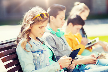 Image showing happy friends with tablet pc computer outdoors