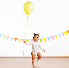 Image showing happy baby girl with balloons on birthday party