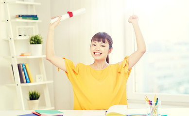 Image showing happy asian woman student with diploma at home