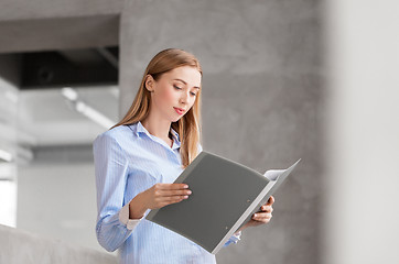 Image showing female office worker with folder