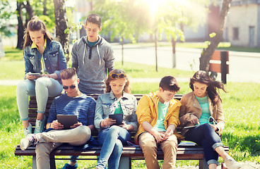 Image showing group of students with tablet pc at school yard