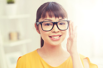 Image showing happy asian young woman in glasses at home