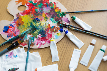 Image showing palette, brushes and paint tubes on table