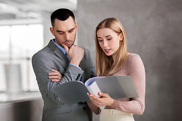 Image showing businesswoman and businessman with folder