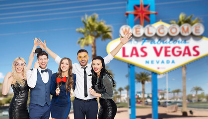 Image showing happy friends with party props posing at las vegas