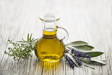 Image showing Olive oil with herbs