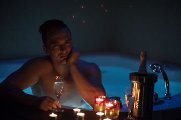 Image showing man relaxing in the jacuzzi