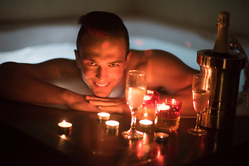 Image showing man relaxing in the jacuzzi