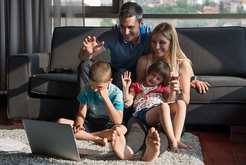 Image showing Family Playing Together with laptop computer