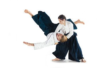 Image showing Man and woman fighting at Aikido training in martial arts school