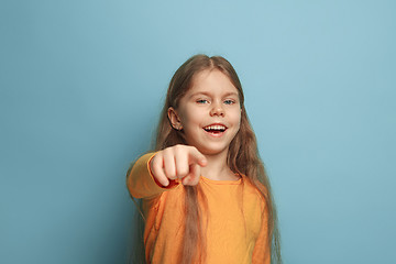 Image showing The determination. Teen girl on a blue background. Facial expressions and people emotions concept