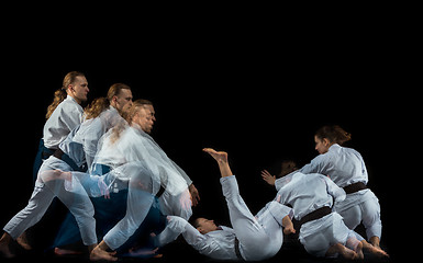 Image showing Man and woman fighting at Aikido training in martial arts school