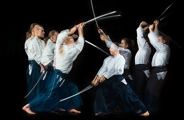 Image showing Man and woman fighting at Aikido training in martial arts school