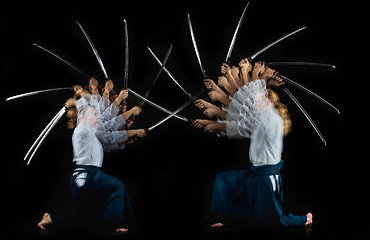 Image showing Man and woman fighting at Aikido training in martial arts school