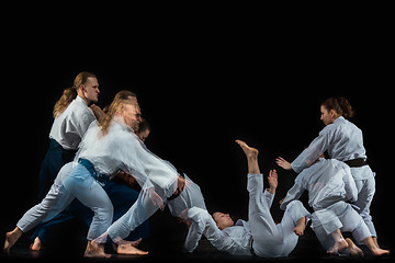 Image showing Man and woman fighting at Aikido training in martial arts school