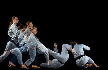 Image showing Man and woman fighting at Aikido training in martial arts school