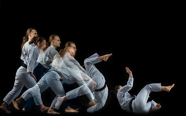 Image showing Man and woman fighting at Aikido training in martial arts school