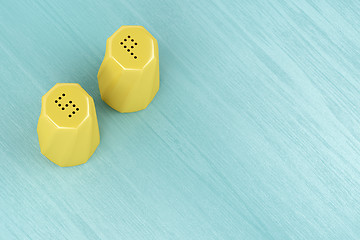 Image showing Yellow salt and pepper shakers